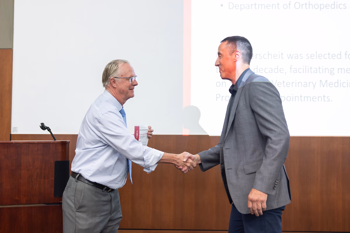 Men shaking hands - UW Institute for Clinical and Translational Research (ICTR) Research Day 2025